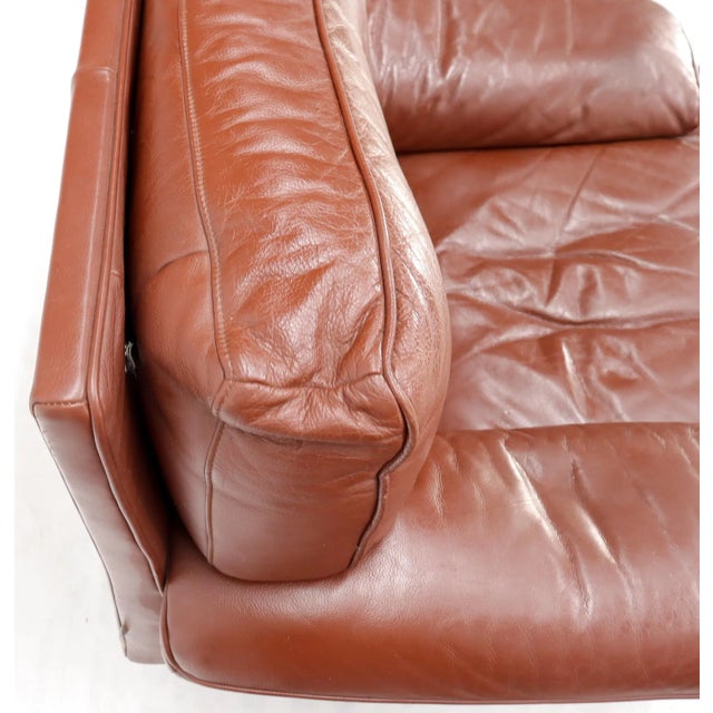 Mid-Century Modern Ligne Roset wide seat lounge chair in brown leather.