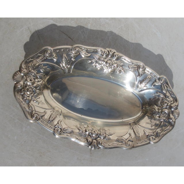 Sterling silver bread tray by Fisher with a Beaux Arts border. Late mid-century design with a large rim low tray. The...