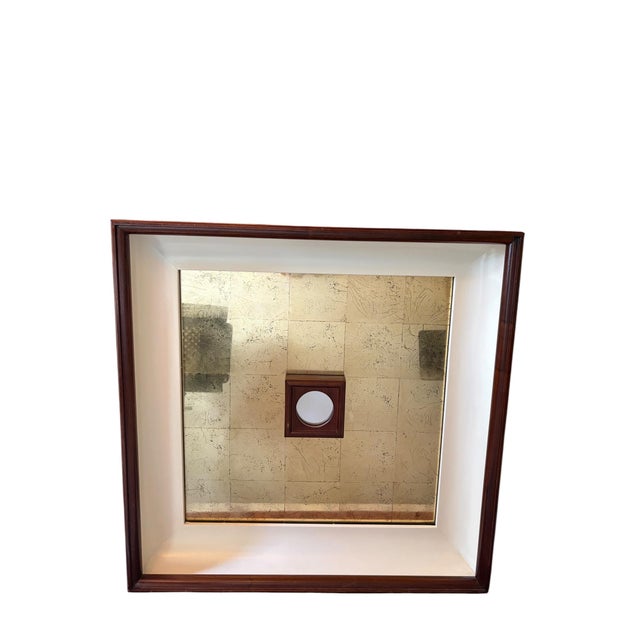 A striking large scale mirror featuring a beautifully aged gold leaf surface set within a richly toned mahogany frame. The...