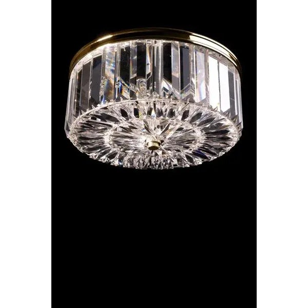 Cut crystal flush mount, 4 inch baguette crystals on outside, patterned crystal on bottom, Cast rim surround on top of...
