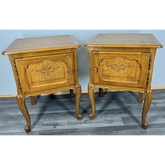 A delightful pair of vintage French Louis-style bedside cabinets , beautifully crafted from oak and featuring elegant...
