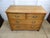 This Edwardian Oak Chest of Drawers is a classic piece of antique furniture with a country style design. Made from solid...
