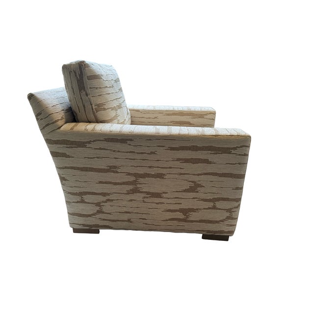 Sophisticated CR Laine lounge chair and matching ottoman upholstered in a high-end textured performance fabric in warm...