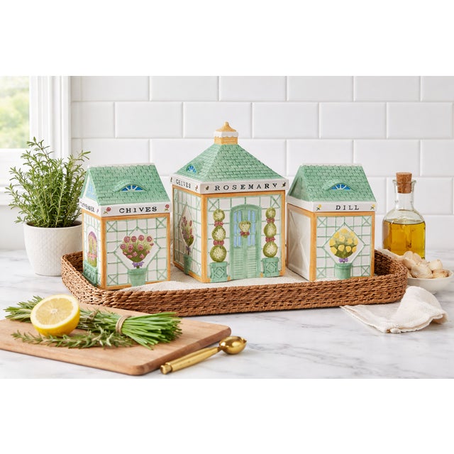 Whimsical, sculptural, and full of garden charm — this collectible set of ceramic canisters was designed by Holly...