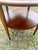 Vintage walnut and oak side table from the Lane Acclaim series. It features a lower circular shelf for additional storage....