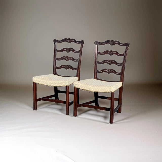 Introducing a stunning pair of Chippendale Style Ribbon Back Chairs, beautifully crafted to embody the timeless elegance...