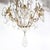 This elegant rock crystal and gilded bronze nine-arm chandelier was realized in France, during the early 19th century. It...