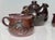This handcrafted set from the workshop of Helma Klett (1908-1996) consists of a bulbous teapot and two matching cups, each...