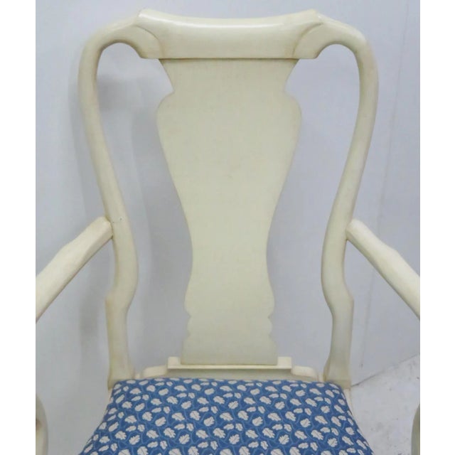 Distressed cream painted frame. Blue upholstered seat with cream leaves. Seat height 19"h.