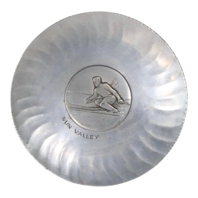 Early 20th Century Souvenir Art Deco Sun Valley Skier Aluminum Plate Made in Switzerland Marked Sigg For Sale