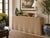 A chic wicker rattan console table with a beautifully scalloped silhouette and tightly woven surface. The piece has the...