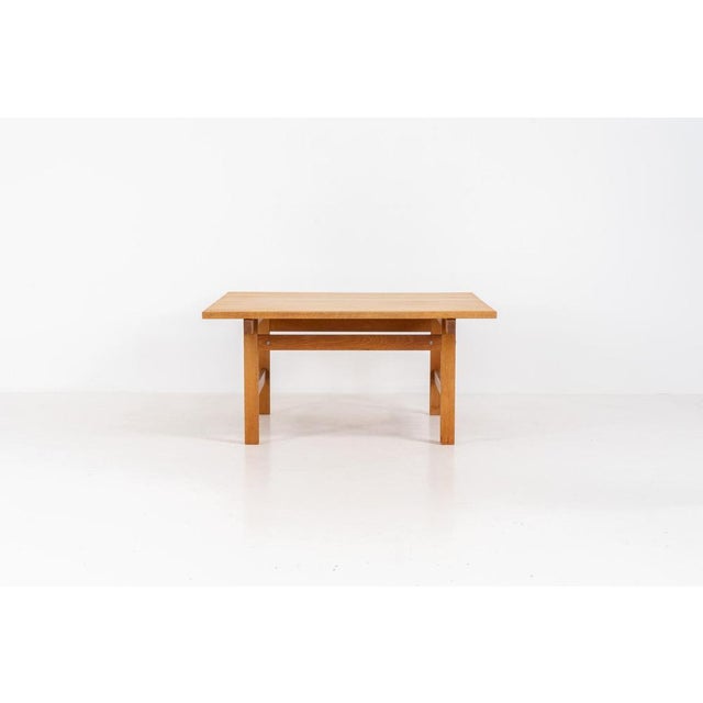 Oak coffee table by Hans J. Wegner for Andreas Tuck (Denmark, 1950s). A wonderful coffee table composed of solid oak with...