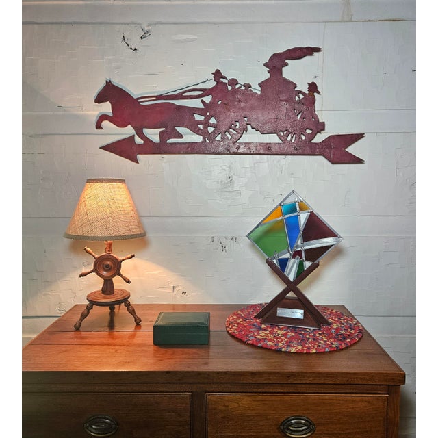 This early 20th-century antique weathervane is a museum-quality piece of American industrial folk art and municipal...
