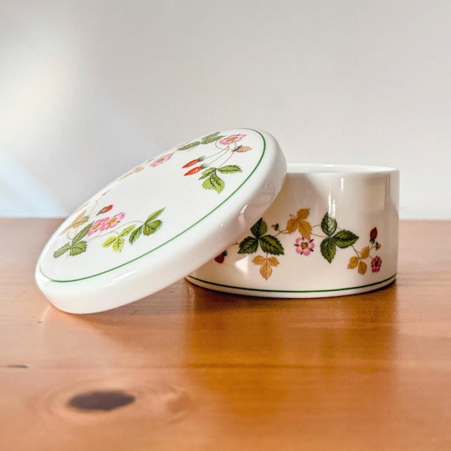 A beautiful little trinket or jewelry box in the 'Wild Strawberry' pattern and made of bone china by Wedgwood. This...