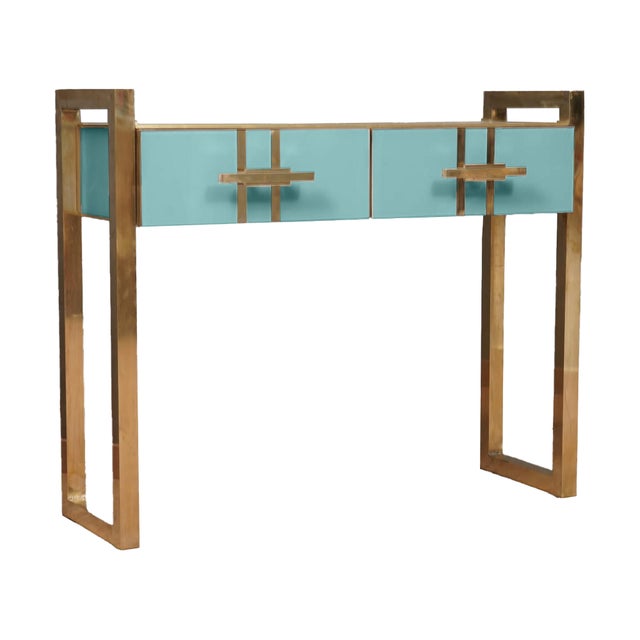Introducing the magnificent turquoise Murano glass console table with brass legs, a masterpiece of Italian craftsmanship...