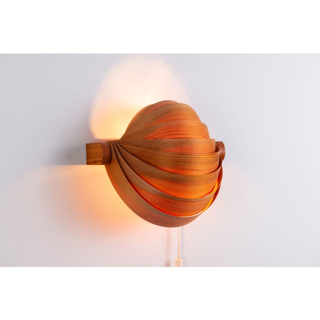 Stunning set of seven visor wall lamps made from pine veneer by Translandia. Each shade is made of strips of pine veneer...