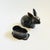 A vintage pewter rabbit shaped box. Dark silver color to the metal with brass accents. The top lifts off to reveal a small...