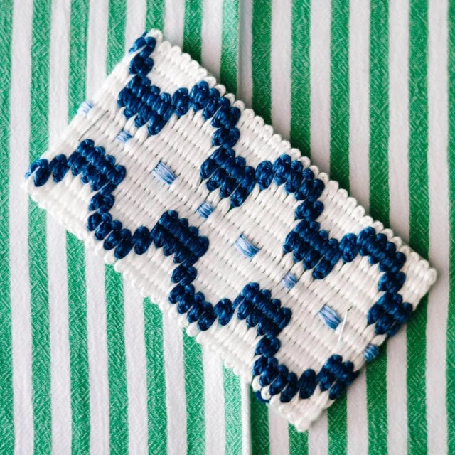 She skipped up the steps of the ancient Greek temple, a vision in decadent prints and patterns in a sea of tired white...