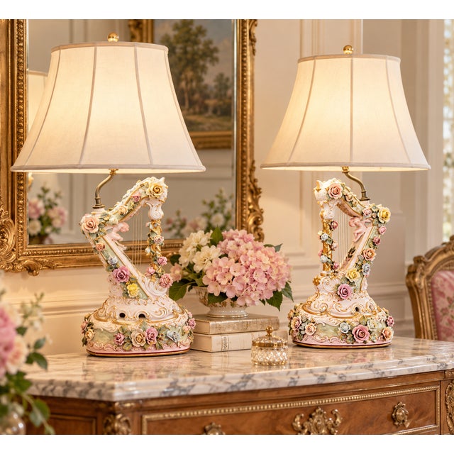 A wonderfully decorative pair of mid-20th-century Italian porcelain table lamps designed in the form of classical harps....