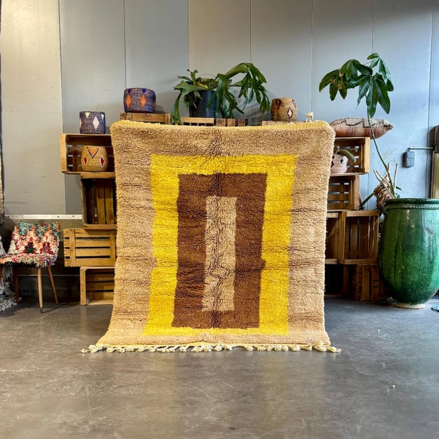 Handwoven with care by skilled artisans, this unique rug combines traditional Moroccan craftsmanship with a contemporary...