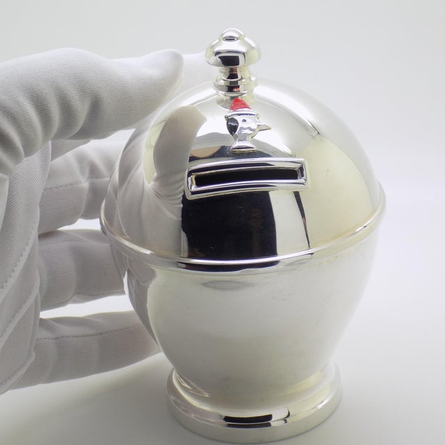 Imbued with literary nostalgia and regional heritage, this vintage italian sterling silver piggy bank elegantly pays...