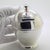 Imbued with literary nostalgia and regional heritage, this vintage italian sterling silver piggy bank elegantly pays...