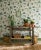 Exquisite depictions of British birds make their home on the delicate branches in this all-over patterned wallpaper....