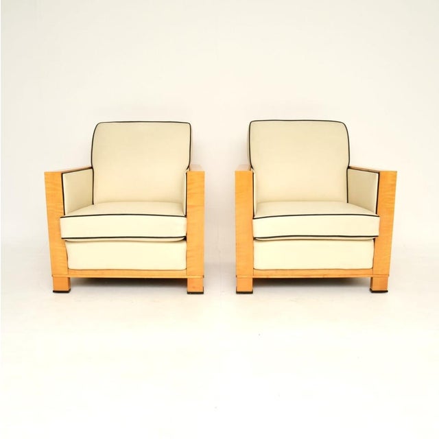 A very stylish and extremely well made pair of Swedish Art Deco armchairs in leather and satin birch. They were recently...