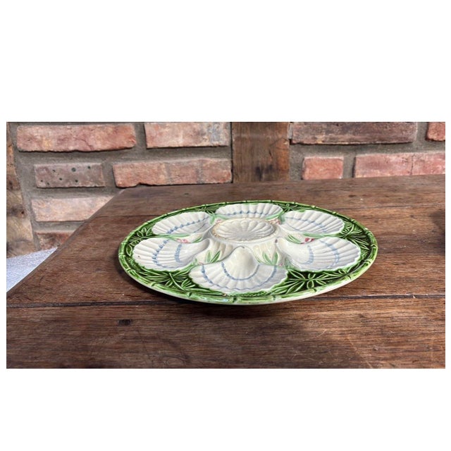 French Majolica oyster plate with bamboo and berries from the manufacture of Salins, circa 1890.