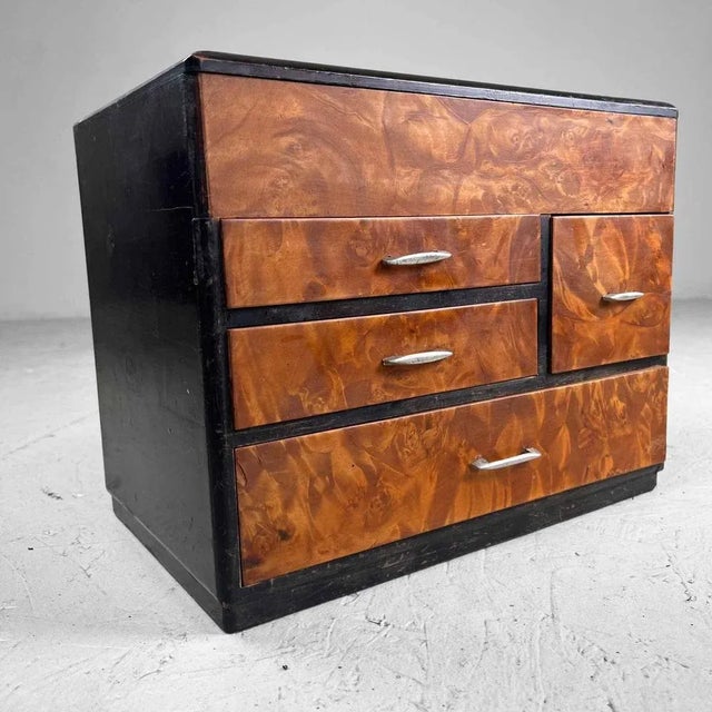 Antique sewing chest from the 1920s from Japan. Features four drawers and a storage space at the top that opens with a...