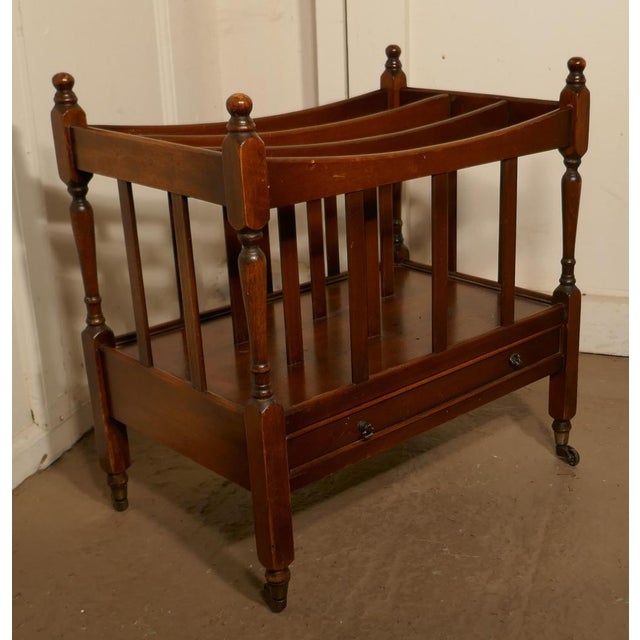 English Walnut Canterbury Magazine Stand This is a pretty little piece, it stands on neat brass casters and has elegant...