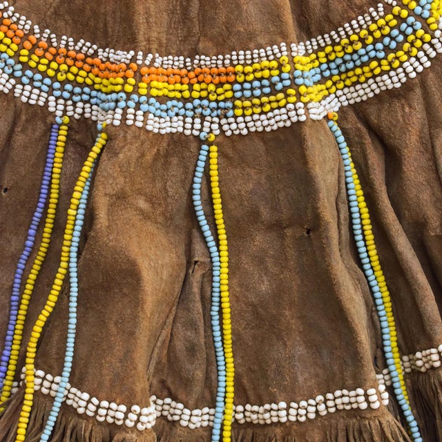 A magnificently beaded leather Olekesana (woman's skirt or cap) from the Maasai. It is made of goatskin or sheepskin...