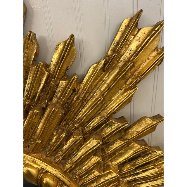 Gorgeous gilt sunburst mirror with staggered jagged sunbursts offering a brightness and happiness to go with it. Very...