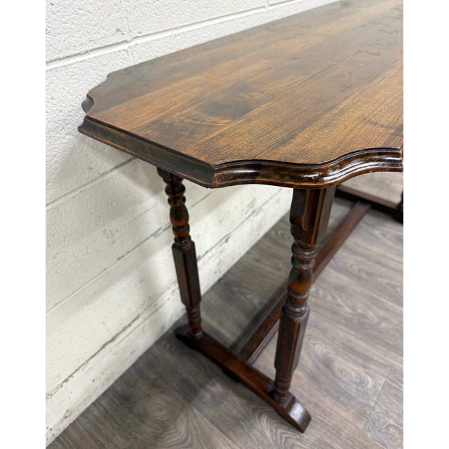This is a beautiful vintage Jacobean Revival sofa table, console table, or hall table in the Berkey & Gay style. It...