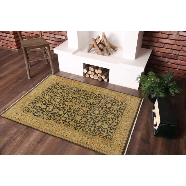 Crafted by skilled artisans using time-honored weaving traditions, this antique low pile handmade wool rug embodies the...