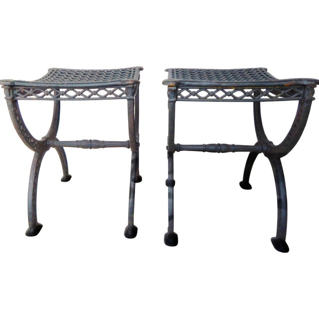 Of neoclassical design and French origin are this pair of cast iron filigree garden stools. Dating to the mid 1800's....