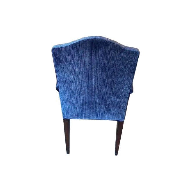This is the Trevor armchair by Century Furniture. The upholstery on the chair is a navy blue velvet. The seat back...