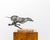A finely executed welded steel sculpture depicting a running greyhound, signed "Gabris" and mounted on its original solid...
