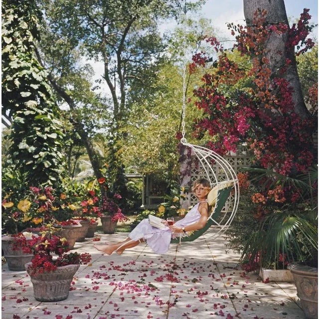 Barbados Bliss (1976) Limited Estate Stamped (Photo By Slim Aarons) Ava Marshall relaxes with a book amongst the...