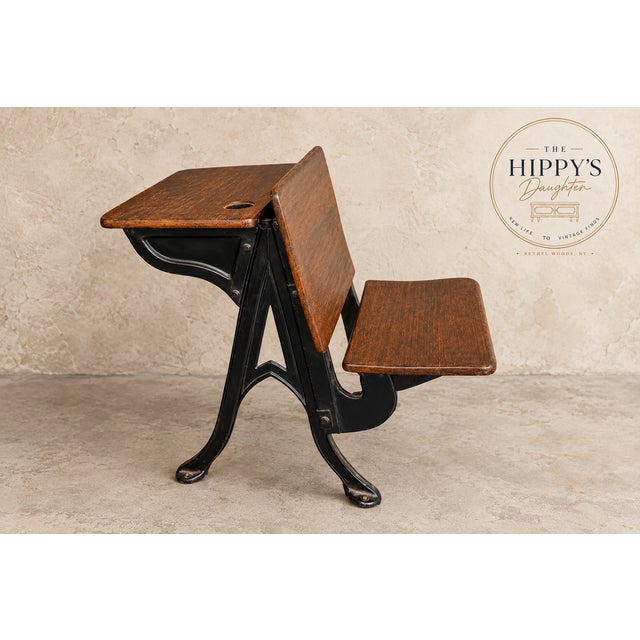 Such a cool statement piece! Beautiful vintage/antique schoolhouse desk with attached seat, featuring warm richly grained...
