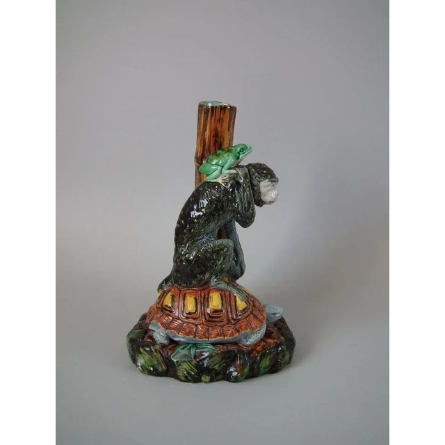 Royal Worcester Majolica vase which features a frog riding on the back of a monkey, which is sitting on the back of a...