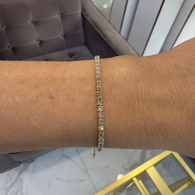 Brand: Levian Gender: Ladies Metal Type: 14K Yellow Gold Weight: 7.83 grams One 14K honey yellow gold diamond tennis...