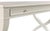 A rectangular top rests over an apron rail drawer flanked by curvaceous intersecting legs. Care Instructions: Wipe with a...