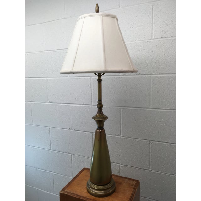 Vintage tall and heavy solid brass table lamp, with Szoke shade signed/stamped on the underside of the base. Made by...