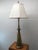 Vintage tall and heavy solid brass table lamp, with Szoke shade signed/stamped on the underside of the base. Made by...