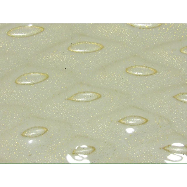 Vintage large Murano glass dish, c.1960’s Designed by Alfredo Barbini, this dish features a process known as ‘bullicante’...