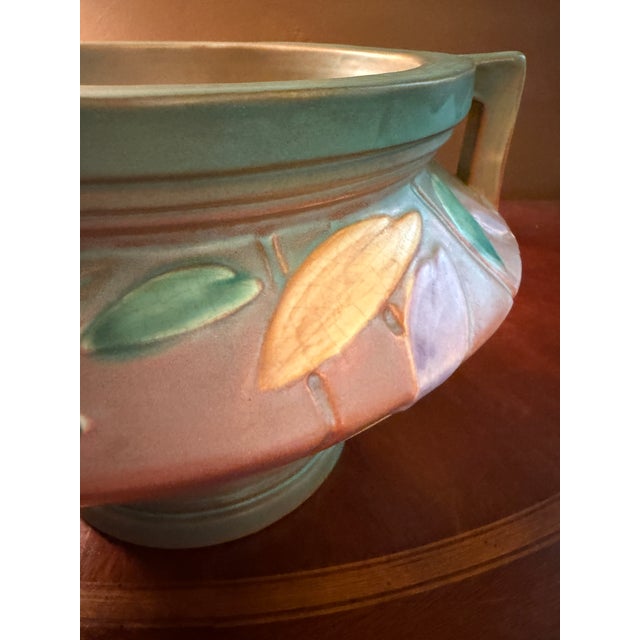 Own an authentic, premier piece of American design history with this magnificent art pottery jardinière from Roseville's...