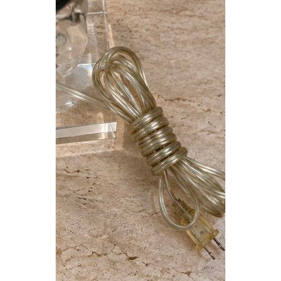 This is a striking clear Lucite table lamp featuring graduated stacked spheres on a substantial rectangular Lucite base....