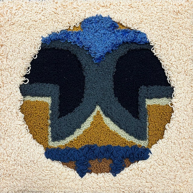A 1976 wool tapestry by the American artist Harry Hilson (1935-2004). This work features a central circle composition with...
