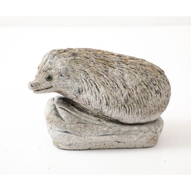 This delightful reconstituted stone hedgehog garden ornament adds a touch of whimsy and charm to your outdoor decor. This...